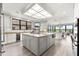 Gourmet kitchen with large center island, stainless appliances, and stunning water views at 429 St Andrews Dr, Belleair, FL 33756