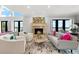 Cozy living room with a fireplace and seating at 429 St Andrews Dr, Belleair, FL 33756
