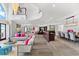 Open-concept living area seamlessly connects the living room, bar, and dining space at 429 St Andrews Dr, Belleair, FL 33756
