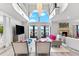 Bright living room featuring a fireplace, water view, and vaulted ceilings at 429 St Andrews Dr, Belleair, FL 33756