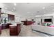 Open-concept area with custom bar, multiple living areas and open flow into the kitchen and dining spaces at 429 St Andrews Dr, Belleair, FL 33756