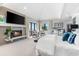 This main bedroom has neutral colors, a fireplace, and a view of the water at 429 St Andrews Dr, Belleair, FL 33756