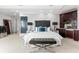 This main bedroom has neutral colors, a wet bar, and a unique mirror feature at 429 St Andrews Dr, Belleair, FL 33756