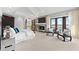 Luxurious main bedroom with fireplace, dark wood trim and a scenic waterfront view at 429 St Andrews Dr, Belleair, FL 33756