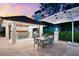Outdoor kitchen and dining area, ideal for entertaining and enjoying alfresco meals at 429 St Andrews Dr, Belleair, FL 33756