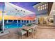 Expansive patio with a pool and spa, perfect for outdoor dining and entertaining at 429 St Andrews Dr, Belleair, FL 33756