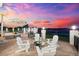 Patio featuring an outdoor lounge area and beautiful waterfront views, perfect for relaxation at 429 St Andrews Dr, Belleair, FL 33756