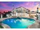 Luxury home exterior with stunning pool and outdoor living area at twilight at 429 St Andrews Dr, Belleair, FL 33756