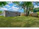 Expansive backyard with lush green grass and a well-maintained exterior at 4304 W Arch St, Tampa, FL 33607