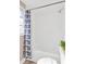 Clean and bright bathroom showcasing the updated shower with a decorative curtain at 4304 W Arch St, Tampa, FL 33607