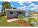 Charming home with well-maintained landscaping and an inviting entrance at 4304 W Arch St, Tampa, FL 33607
