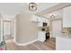 Open-concept kitchen with stainless steel appliances and a view to the living room at 4304 W Arch St, Tampa, FL 33607