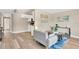 Open-concept living room features wood floors and a view to the modern kitchen at 4304 W Arch St, Tampa, FL 33607