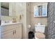 Well-lit bathroom featuring a vanity, mirror, and toilet at 4306 La Mora Ct, Tampa, FL 33611