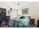 Cozy bedroom with a plush bed, dresser, and charming decor at 4306 La Mora Ct, Tampa, FL 33611