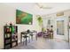 Bright dining area with stylish decor, modern table and chairs, and backyard access at 4306 La Mora Ct, Tampa, FL 33611
