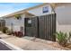 Property exterior with a wooden fence, garden decor, and street access at 4306 La Mora Ct, Tampa, FL 33611