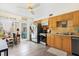 Functional kitchen with wooden cabinets, stainless steel appliances, and backyard access at 4306 La Mora Ct, Tampa, FL 33611