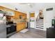 Well-equipped kitchen with stainless steel appliances, wooden cabinets, and laundry area at 4306 La Mora Ct, Tampa, FL 33611