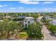 Aerial view of new construction townhome with a view of downtown in the distance at 500 E Davis Blvd, Tampa, FL 33606