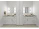 Bright bathroom featuring double vanity, granite countertops, modern lighting, and ample cabinet space at 500 E Davis Blvd, Tampa, FL 33606