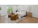Bright bedroom with hardwood floors, a cozy seating area, and serene decor at 500 E Davis Blvd, Tampa, FL 33606