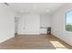 Bright bedroom with wood floors, white walls, and wet bar at 500 E Davis Blvd, Tampa, FL 33606