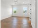 Spacious bedroom featuring hardwood floors and plenty of natural light from the windows at 500 E Davis Blvd, Tampa, FL 33606