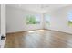 Bright bedroom with hardwood floors and multiple large windows at 500 E Davis Blvd, Tampa, FL 33606