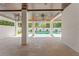 Open covered patio offering a seamless transition to the backyard pool area, with wood ceilings and ample space at 500 E Davis Blvd, Tampa, FL 33606