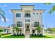 Contemporary two-story home featuring a symmetrical facade, black accents and manicured lawn with tropical landscaping at 500 E Davis Blvd, Tampa, FL 33606