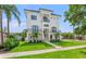 Stunning two-story white home with modern architecture, balconies, and lush green lawn at 500 E Davis Blvd, Tampa, FL 33606