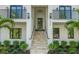 Elegant home entrance with grand staircase, manicured landscaping, and stylish modern accents at 500 E Davis Blvd, Tampa, FL 33606