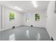 Garage space with natural light, epoxy flooring, and ceiling fan at 500 E Davis Blvd, Tampa, FL 33606