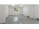 Bright, spacious garage with epoxy flooring and large windows at 500 E Davis Blvd, Tampa, FL 33606