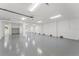 Spacious garage with epoxy flooring, recessed lighting, and ample room for multiple vehicles at 500 E Davis Blvd, Tampa, FL 33606