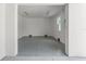 Finished garage space featuring epoxy flooring, recessed lighting and ample room at 500 E Davis Blvd, Tampa, FL 33606