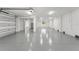 Expansive garage featuring epoxy flooring, ample lighting, and neutral paint at 500 E Davis Blvd, Tampa, FL 33606