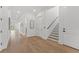 Inviting hallway with hardwood floors, neutral walls, and staircase at 500 E Davis Blvd, Tampa, FL 33606