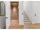 Hallway featuring an elevator, wooden stairs, and wood flooring throughout at 500 E Davis Blvd, Tampa, FL 33606