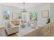 Bright living room features modern chandelier, plush seating, and access to a balcony at 500 E Davis Blvd, Tampa, FL 33606