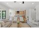 Open living space featuring hardwood floors, a kitchen, sofas, and natural light at 500 E Davis Blvd, Tampa, FL 33606