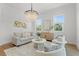 Bright living room with plush seating, wood floors, and decorative chandelier at 500 E Davis Blvd, Tampa, FL 33606