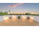 Rooftop terrace featuring decorative lights and sunset views at 500 E Davis Blvd, Tampa, FL 33606