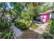 Lush backyard landscape with mature plantings at 5051 5Th S Ave, St Petersburg, FL 33707
