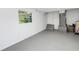 Finished basement area with painted floor at 5051 5Th S Ave, St Petersburg, FL 33707