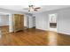 Spacious bedroom featuring wood floors, closet, and ensuite bathroom entrance at 5051 5Th S Ave, St Petersburg, FL 33707