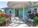 Close-up of the charming front porch, showcasing the unique architectural details and inviting entrance at 5051 5Th S Ave, St Petersburg, FL 33707