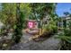 Charming, colorful home with lush landscaping, unique gravel and stone pathway leading to the entrance at 5051 5Th S Ave, St Petersburg, FL 33707
