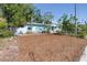 Charming cottage-style home with well-manicured lawn and inviting picket fence at 5051 5Th S Ave, St Petersburg, FL 33707